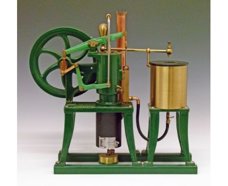 Replica model of a Rider Ericsson vertical hot air pumping engine having a 9" spoked fly wheel and supported on a cast stand,