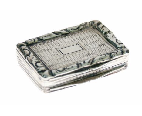 William IV silver vinaigrette having engine turned decoration, the hinged cover opening to reveal a gilded interior with pier