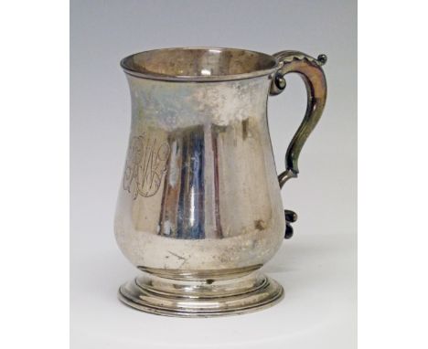 George III silver baluster shaped mug, the scroll handle with acanthus decoration and standing on a circular foot, maker Fran