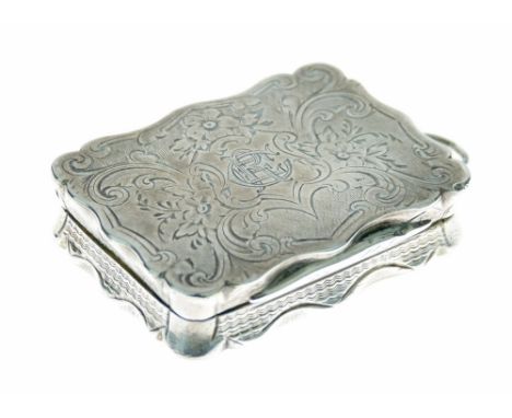 Victorian silver vinaigrette having engraved foliate decoration, the hinged cover opening to reveal a gilded interior with pi