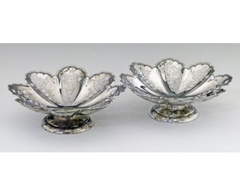 Pair of Victorian silver shaped circular sweetmeat stands, each having pierced decoration and standing on a circular foot, ma