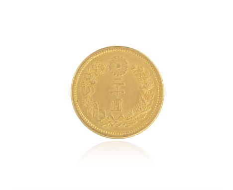 A JAPANESE 20 YEN GOLD COIN, struck with sunburst within a textual band, the obverse with a ribbon tied wreath and chrysanthe