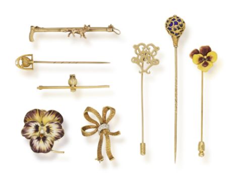 A GROUP OF NINE TIE PINS OR BROOCHES, two brooches, four tie pins and two bar brooches, mounted in various gold* This lot is 