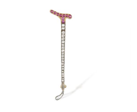 AN EARLY 20TH CENTURY GEM-SET TIE PINDesigned as an elongated arrow, both terminals set with a row of synthetic rubies accent