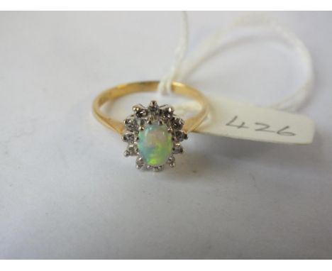 Oval opal and diamond cluster ring set in gold, size M   