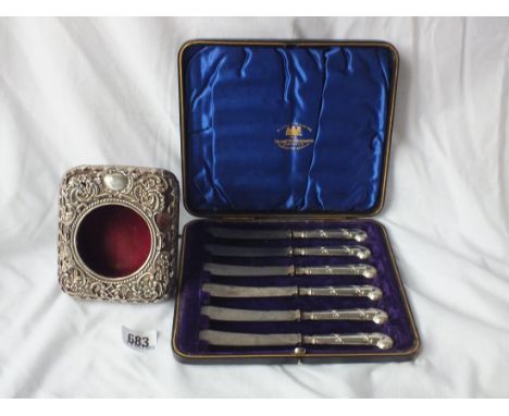 Boxed set of pistol handle tea knives, also a clock case   