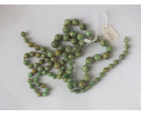 A string of old jade beads       