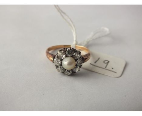 An antique pearl and eight stone diamond bordered ring,  set in gold, size P       