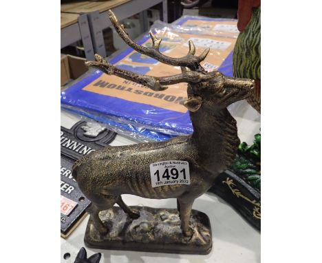 Cast iron bronze effect stag figurine, H: 28 cm. No cracks, chips or visible restoration. P&amp;P Group 2 (£18+VAT for the fi