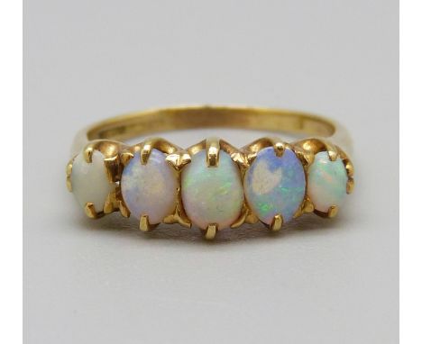 An yellow metal and five stone opal ring, 3.5g, M, hallmark worn 