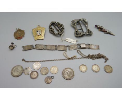 Two silver buckles, a silver and enamel badge, a silver fob, a silver dirk brooch, a silver bracelet, a/f, and a collection o