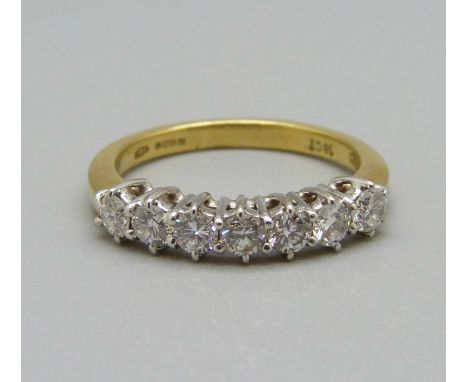 An 18ct gold seven stone diamond ring, 3.6g, M 