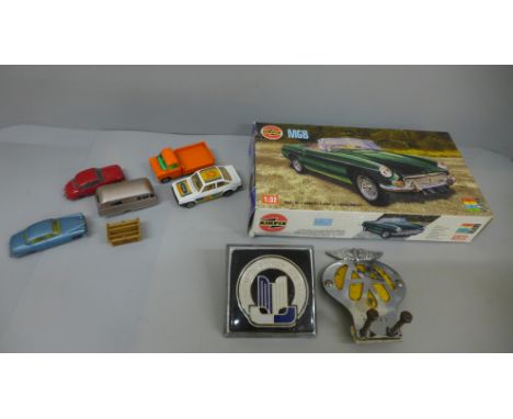 An Airfix MGB kit, five die-cast model vehicles and two car badges, Triumph Sports Six Club and AA, numbered 51514Y 