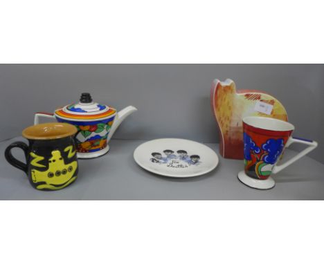 Assorted pottery; a Sadler Clarice Cliff style teapot and mug, a Royal Worcester cat and two pieces of Beatles pottery 