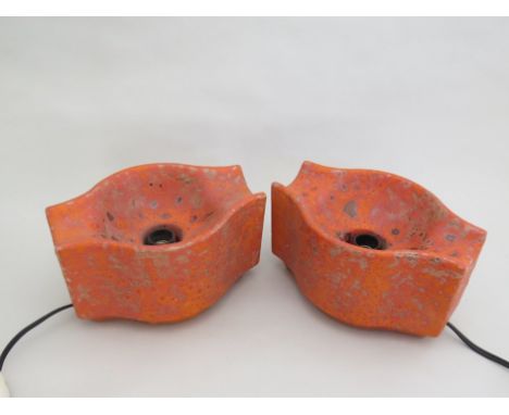 A pair of West German textured ceramic orange lights 