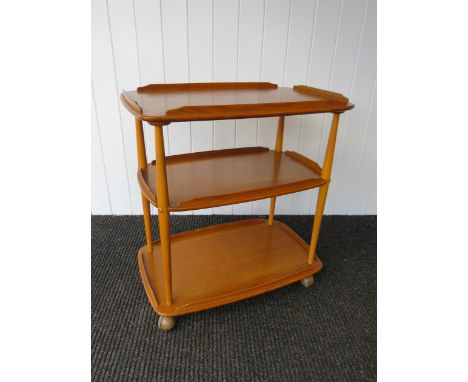 A 1960's Ercol light elm trolley of three tiers 
