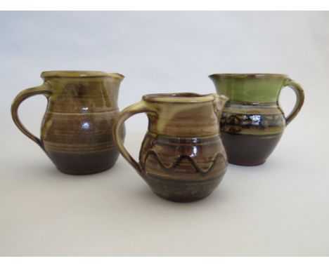 Two Winchcombe Pottery jugs by Sidney Tustin and another 