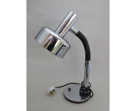 A metal desk lamp with cylindrical shade and a flexible chrome table lamp 