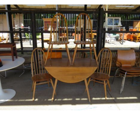 An Ercol light elm drop leaf table and four hooped stick back chairs 