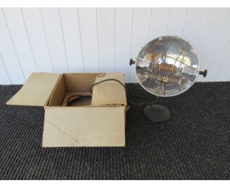 A industrial metal heater/light on black base/stand 