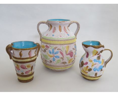 An Italian 1950's twin handled vase with floral enamel dot detail and two smaller vases 