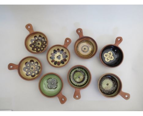 Eight Winchcombe Pottery Sidney Tustin dishes with single handles 