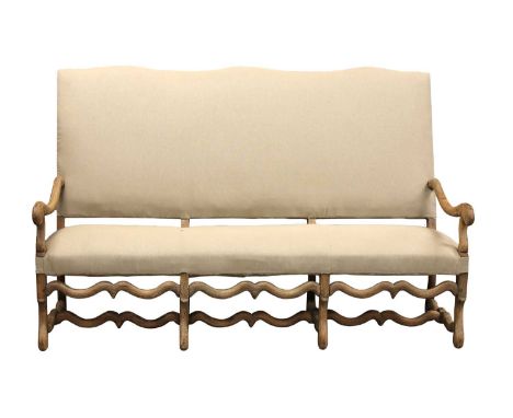 A French bleached oak three-seater sofa,19th century, in the 'Os de Mouton' style, with an arched back and scrolling frame, u