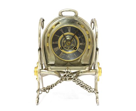 An unusual French silver-plated table clock,late 19th century, the dial and movement mounted in a horseshoe, supported on nic