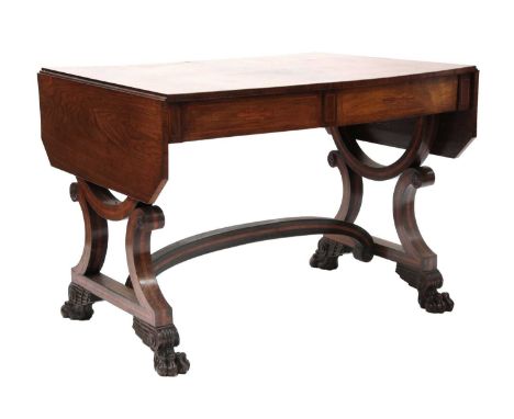 A Regency rosewood sofa table, with angled corners, alternate blind frieze drawers, on half hoop and scroll end supports and 