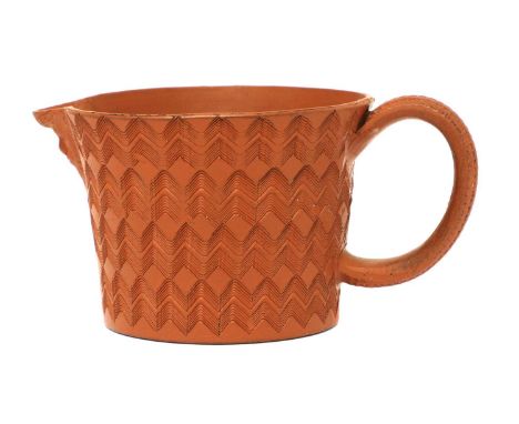 A Staffordshire redware conical milk jug,c.1760, with a basket moulded handle and all-over engine-turned decoration, impresse