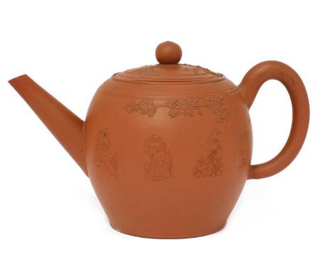 A Staffordshire redware large ovoid teapot and cover,c.1780-90, with a loop handle, conical spout and ball knop, applied with