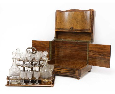 A Victorian burr walnut tabletop drinks cabinet,the top inlaid with a shaped mother-of-pearl cartouche with rosewood crossban