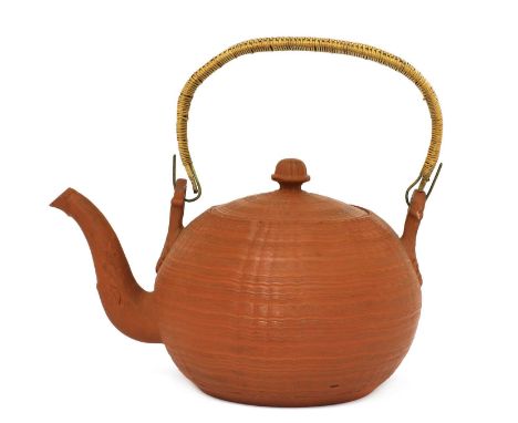 A Staffordshire redware globular tea kettle and cover,c.1760, the wicker bound swing handle with leaf moulded lugs and a leaf