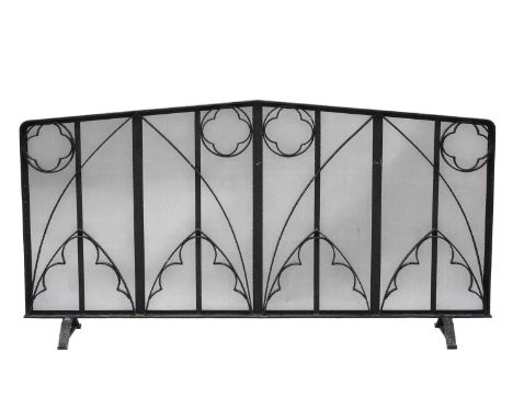 A very large iron fireguard,contemporary, of Gothic design, raised on bracket feet,216cm wide39cm deep110cm highCondition rep