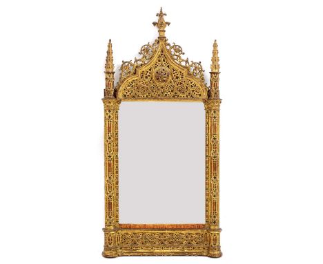 A Gothic Revival wall mirror,late 19th century, the ornately carved and fret cut frame with gilt and enamel decoration,56cm w