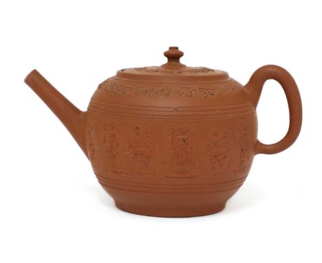 A Staffordshire redware globular teapot and cover,c.1765, with a loop handle, conical spout and turned knop, applied with a b