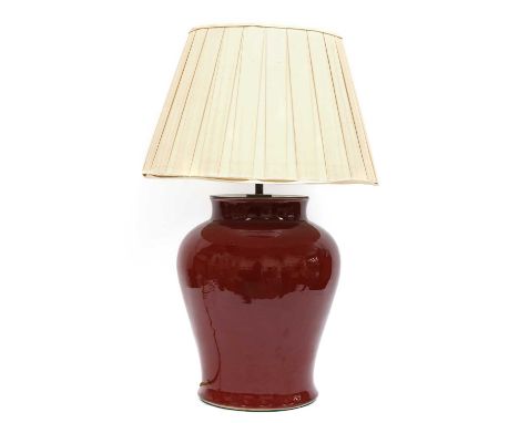 A large Chinese-style red-glazed porcelain table lamp, contemporary, by Vaughan Designs, of baluster form, 51cm high, with a 