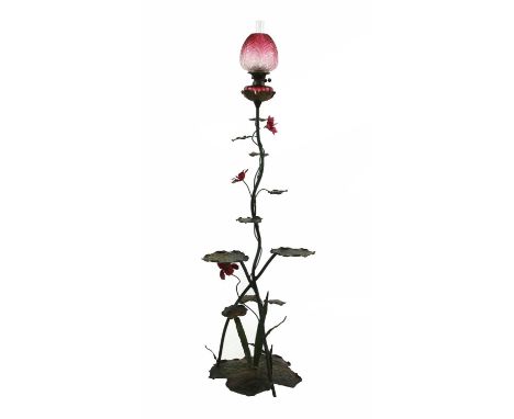 A French wrought and painted brass standard oil lamp,late 19th century, in the form of waterlilies, the floral shade and lobe
