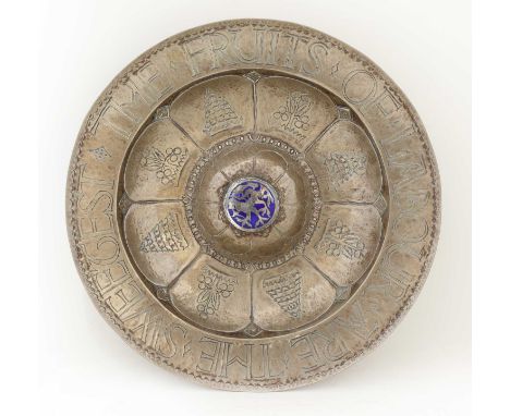 An Arts &amp; Crafts planished rosewater bowl,c.1900, silver-plate on copper, the central blue enamel boss with an inset silv
