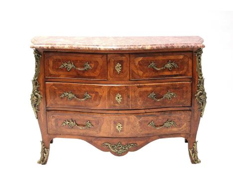A French Louis XVI walnut commode,the marble top over a serpentine front, having three short over two long drawers, all with 