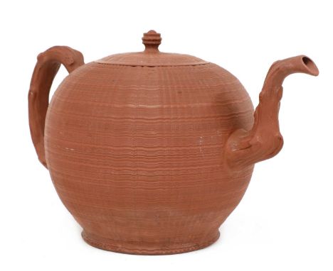 A rare Staffordshire redware globular punch pot and cover,c.1765, with a crabstock handle and spout, turned knop and all-over