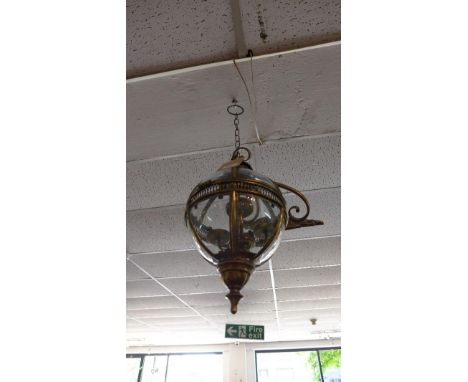 A gilt metal wall hanging globular storm lantern 