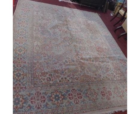 A large early 20th century carpet, with William Morris style spirit design 