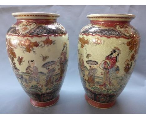 A pair of 20th century Japanese ceramic vases, decorated with figures in courtyard scenes, H.32cm 