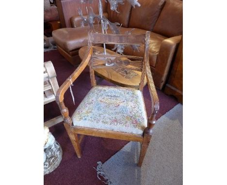 A Regency mahogany armchair, with tapestry upholstered drop in seat 