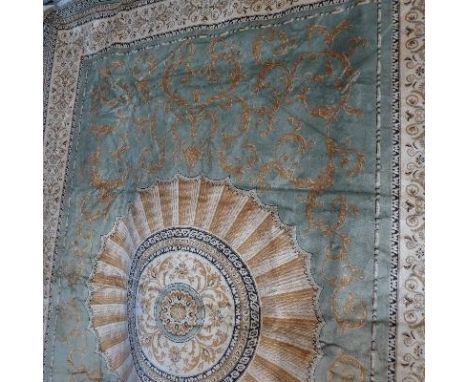 An Aubusson style carpet, with central floral design, on a green ground, contained by floral border, 280x200cm 