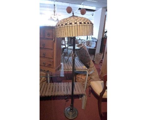A Tiffany style standard lamp, with leaded glass shade on circular base, H.172cm 