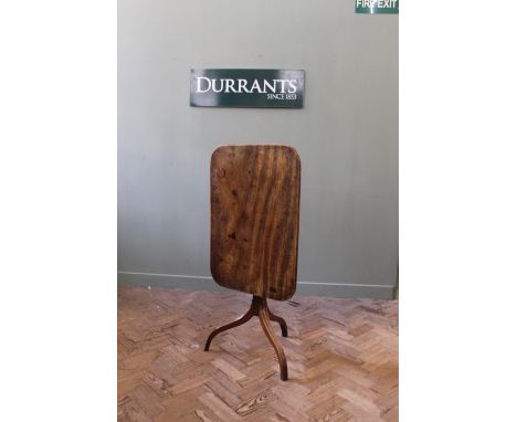 An early 19th Century mahogany tripod table with rectangular top