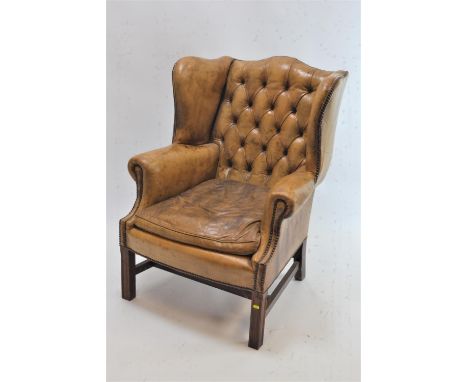 Leather button backed armchair.