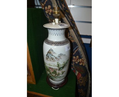 Chinese vase decorated with figuires in a mountainous scene converted to a lamp, 43cm high overallwires cut.Shipping not avai